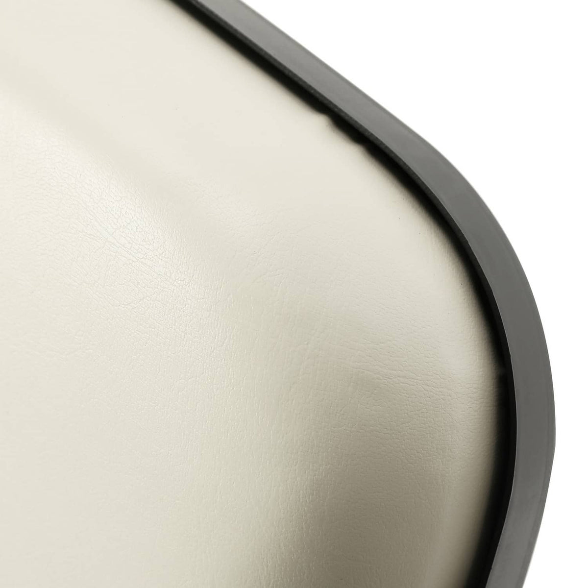 Off-white cushion surface with dark edge piping detail