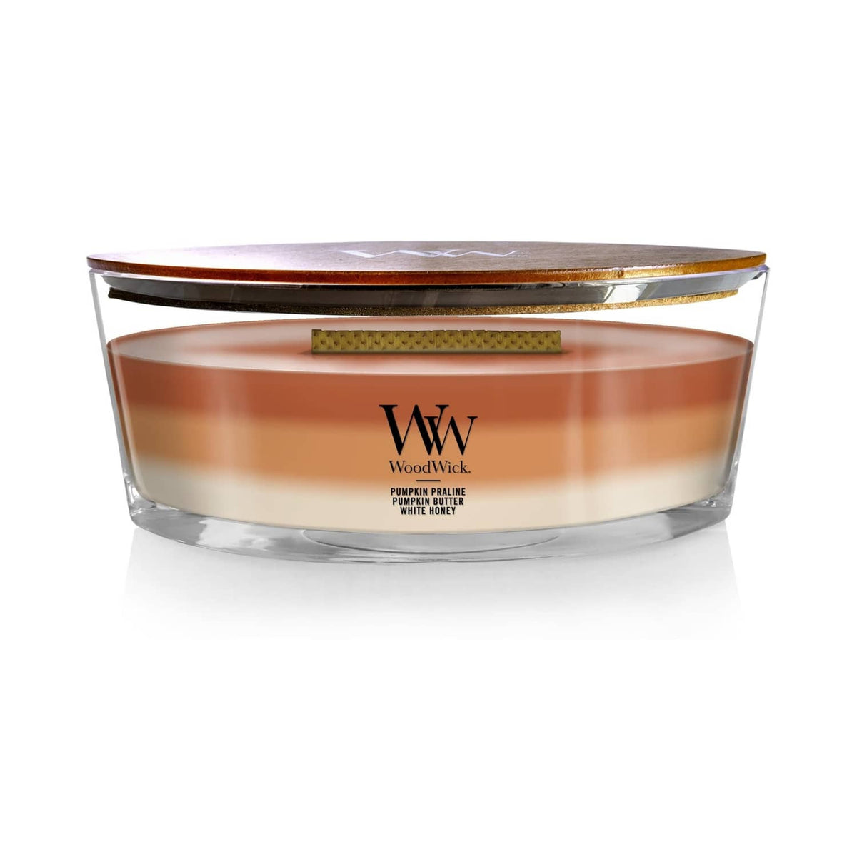 Glass jar candle with amber-orange wax and WoodWick logo label
