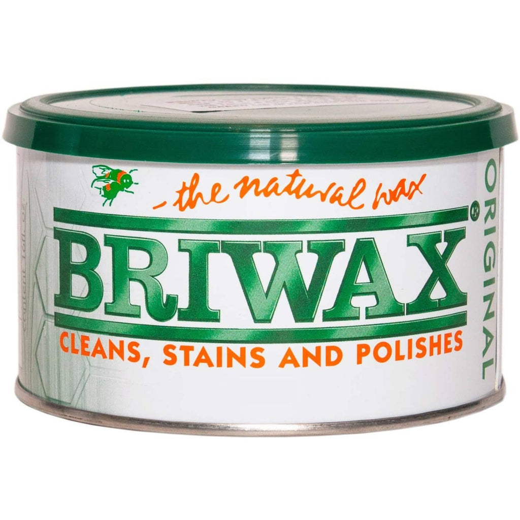 Dark brown furniture wax tin with green lid