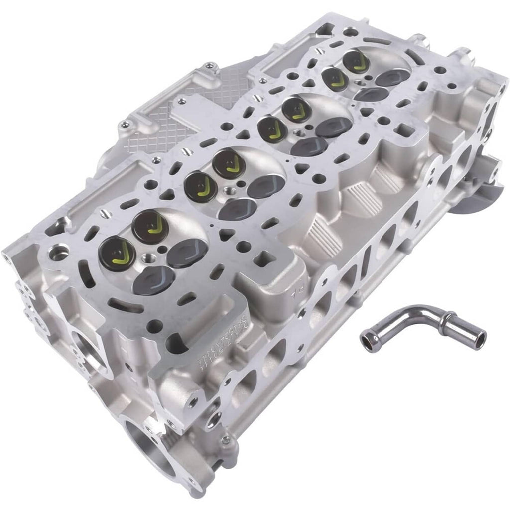 Cylinder head assembly showing cylinder bores, valve openings, and spark plug wells