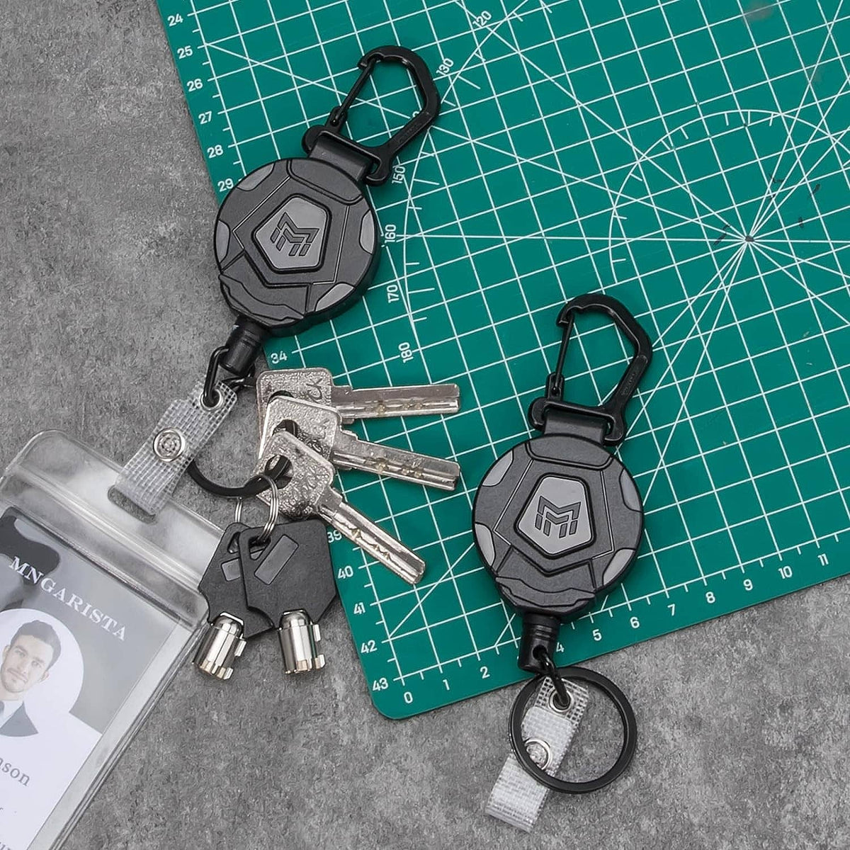 2-pack retractable keychains with black housings, carabiners, and metal keys