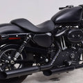 Black solo motorcycle seat with contoured cushion and stitched seam, mounted on a bike