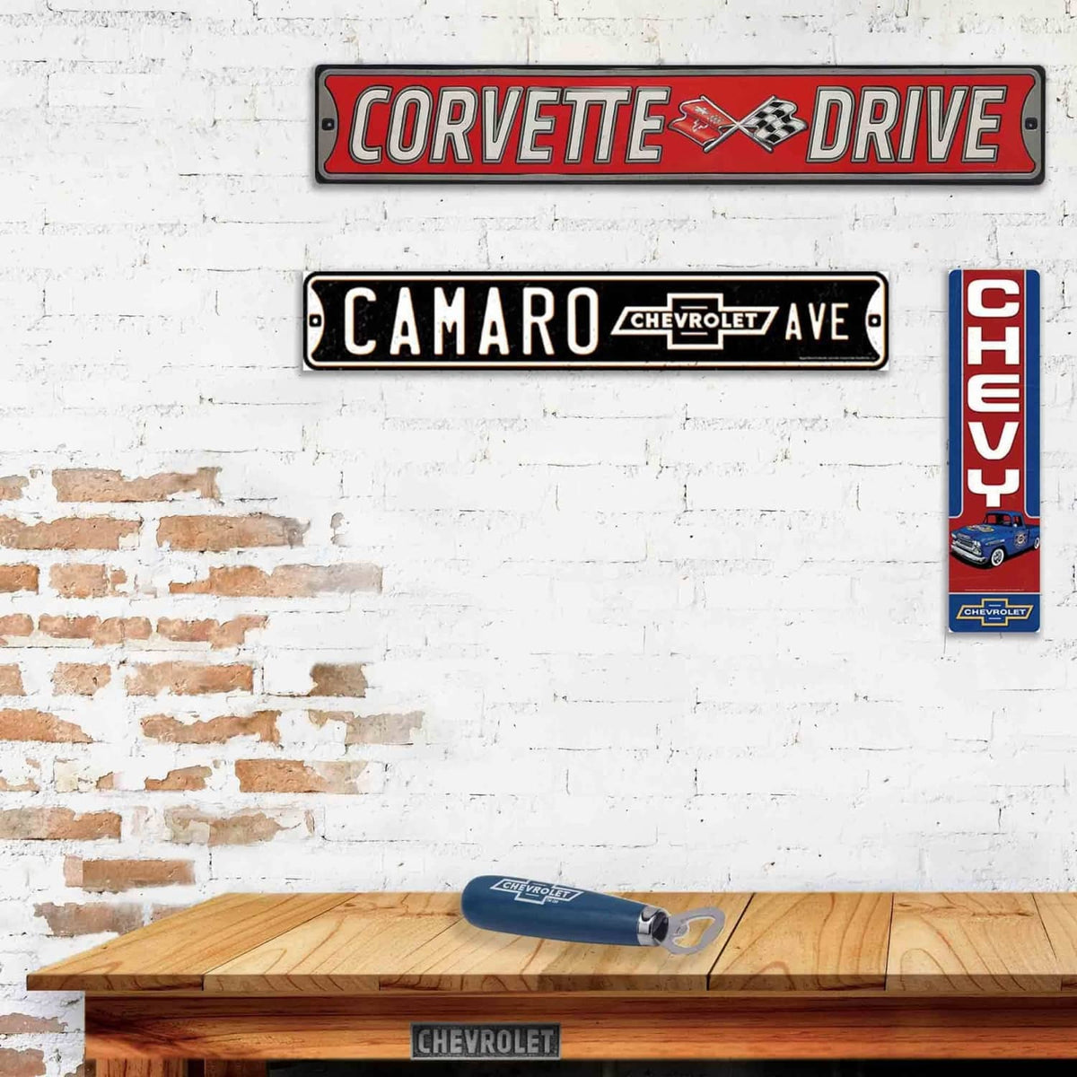 Chevrolet metal wall sign, partial view with red CH EV Y lettering and blue Chevy badge.