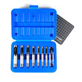 Hollow punch set in open blue case with grid cutting mat and silver punches
