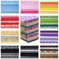 Multicolor cotton fabric squares, stacked with stripes and small printed patterns