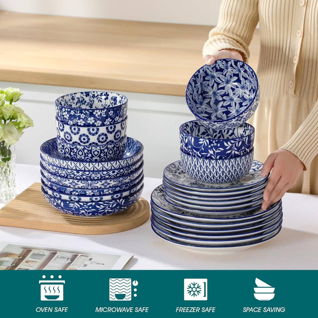 Stacked blue-and-white patterned bowls and plates on a wooden tray