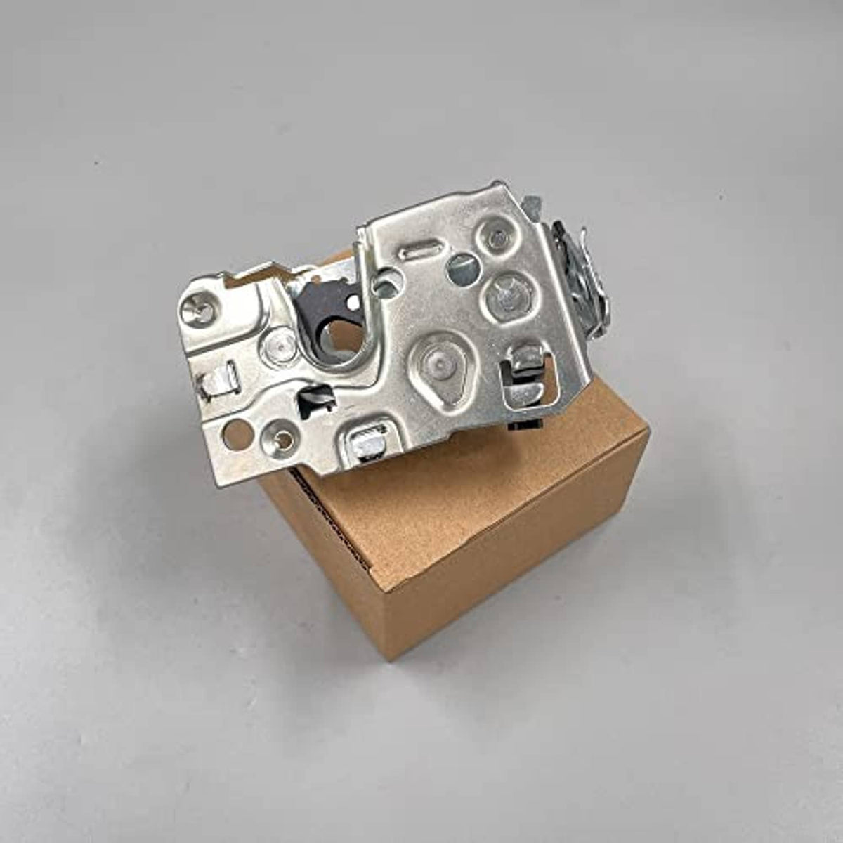 Front door latch lock mechanism, silver metal assembly with screw holes on box