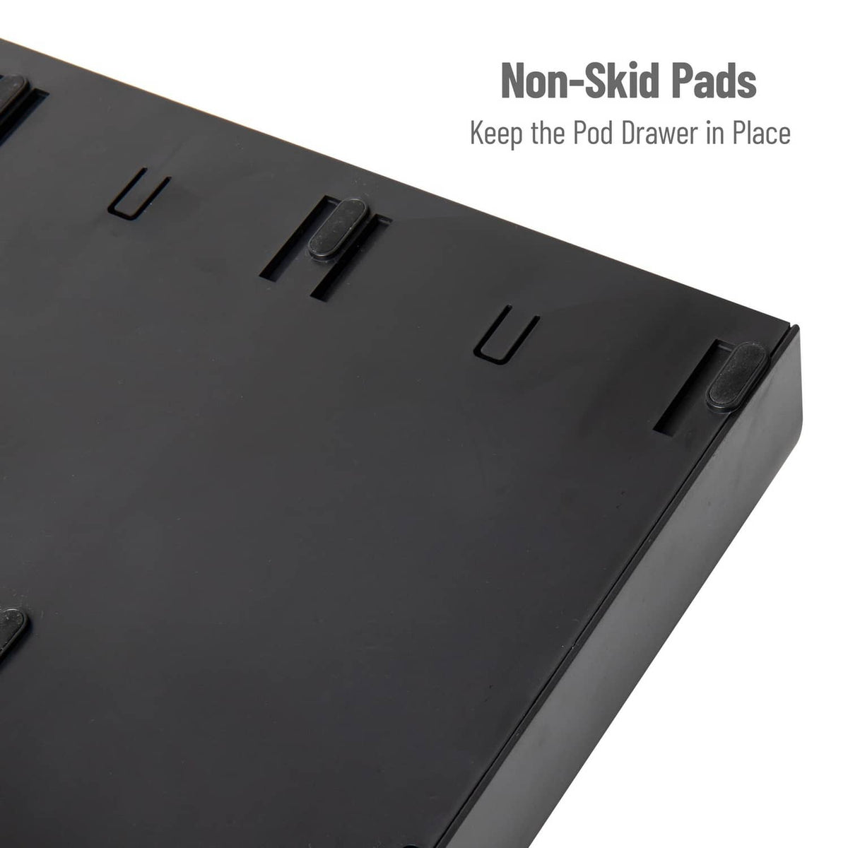 Black organizer drawer with non-slip pads detail on top surface