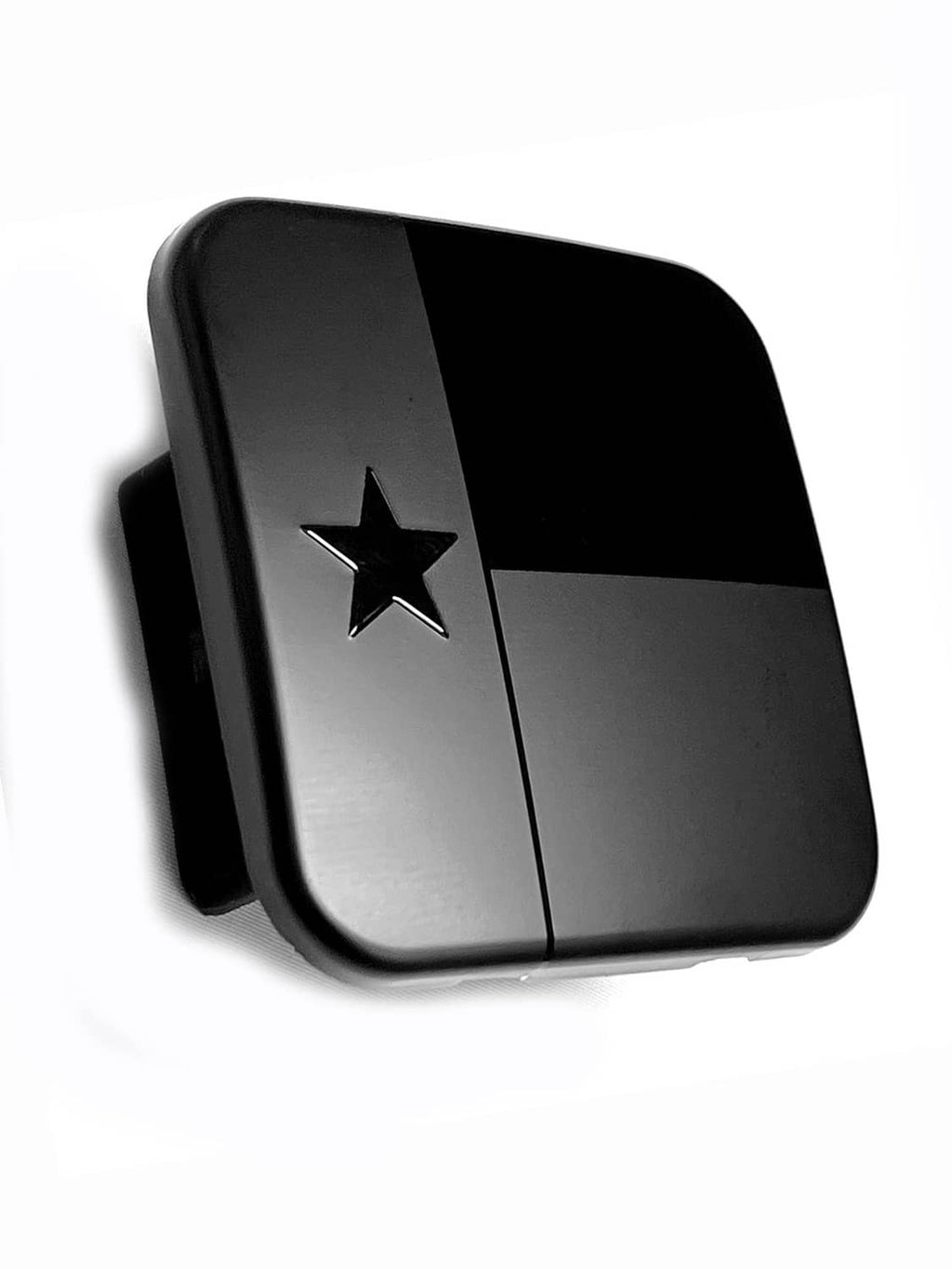 Black metal hitch receiver cover plug with Texas star emblem and hinged design.
