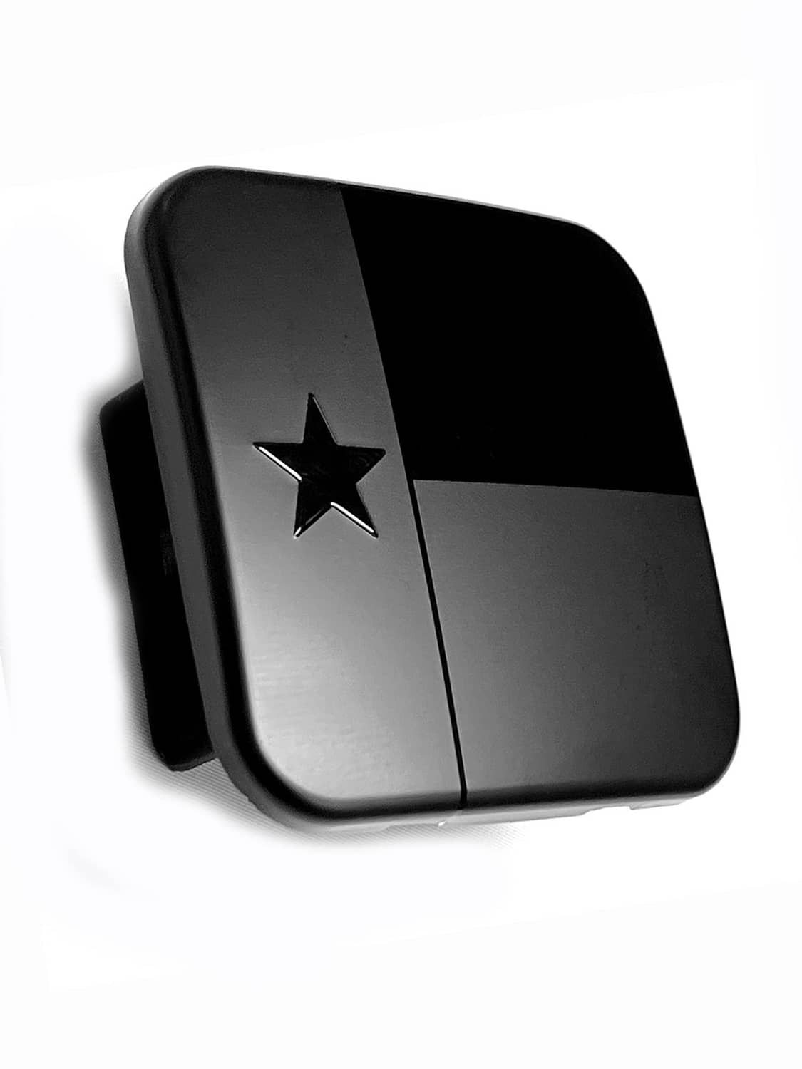 Black metal hitch receiver cover plug with Texas star emblem and hinged design.