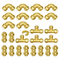 Assorted gold brass push-fit pipe fittings set with elbows, tees, and straight couplings