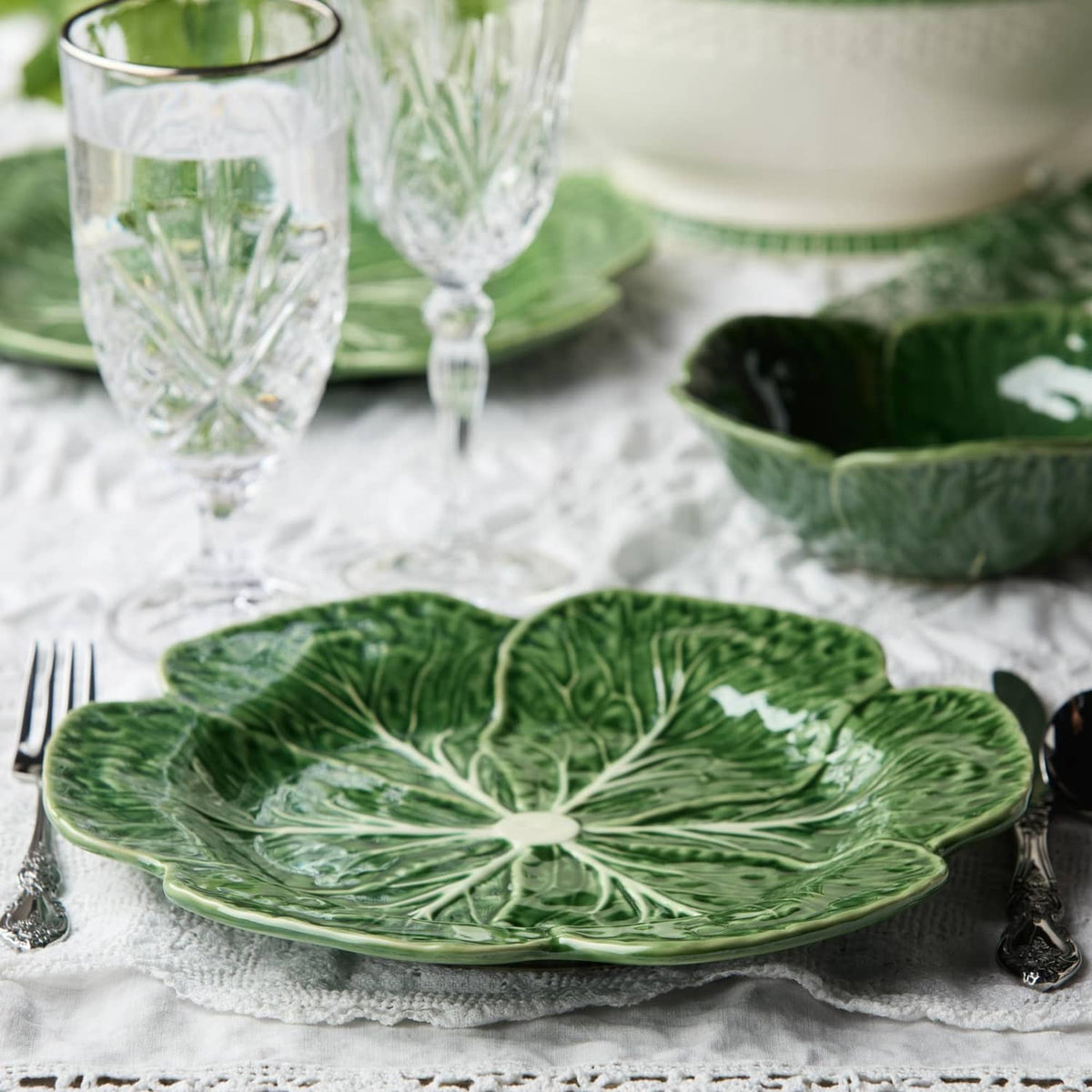 Green cabbage-pattern dinner plates, set of four; one plate shown with white veins.