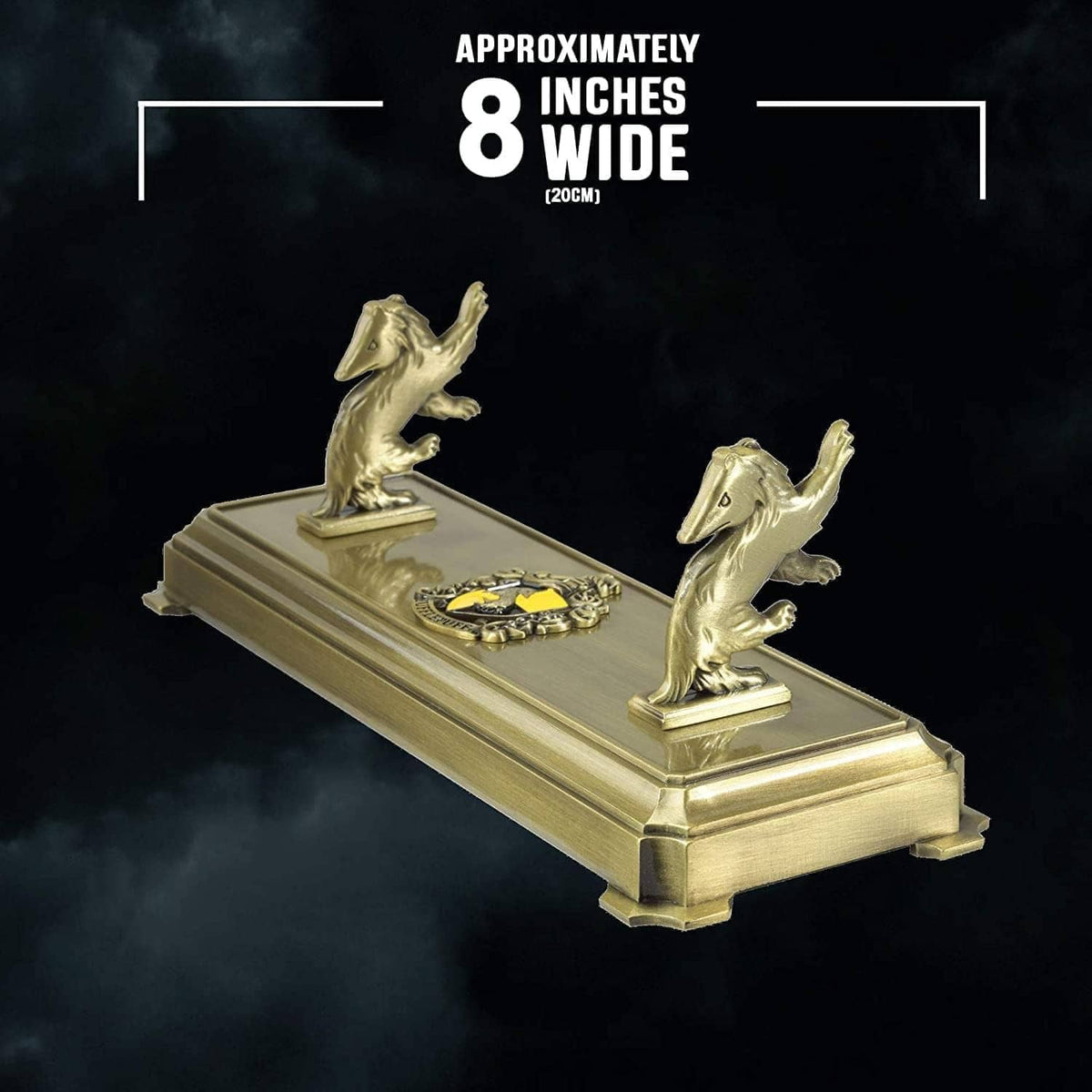 Gold-tone wand stand with two badger statues and circular emblem, with size label