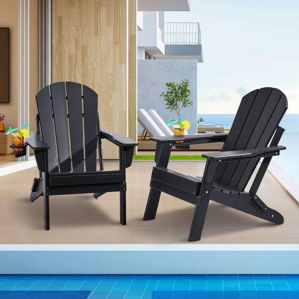 Set of 2 black folding Adirondack patio chairs with slatted backs and armrests, side view
