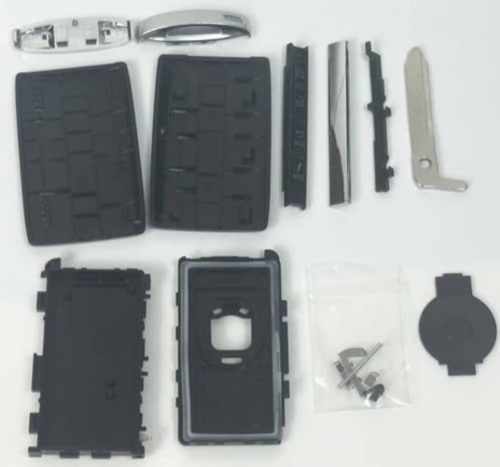 Disassembled black key fob case shell kit with buttons, insert, blade, and screws
