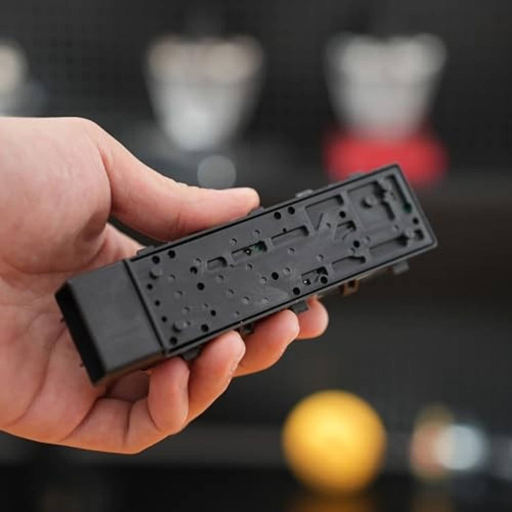 Power seat switch module underside with molded contact openings and pin guides