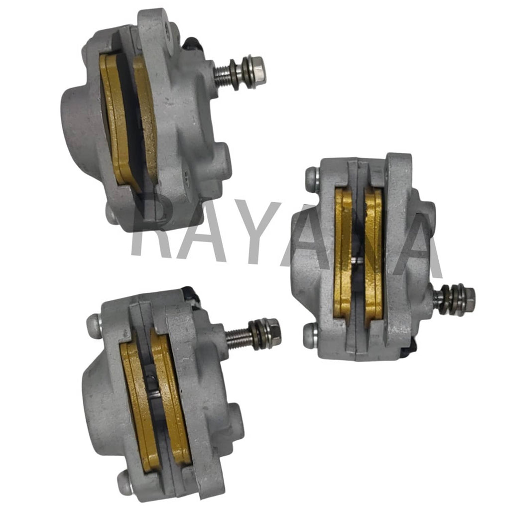 Front brake calipers with gold brake pads visible, grey cast housings and bolts