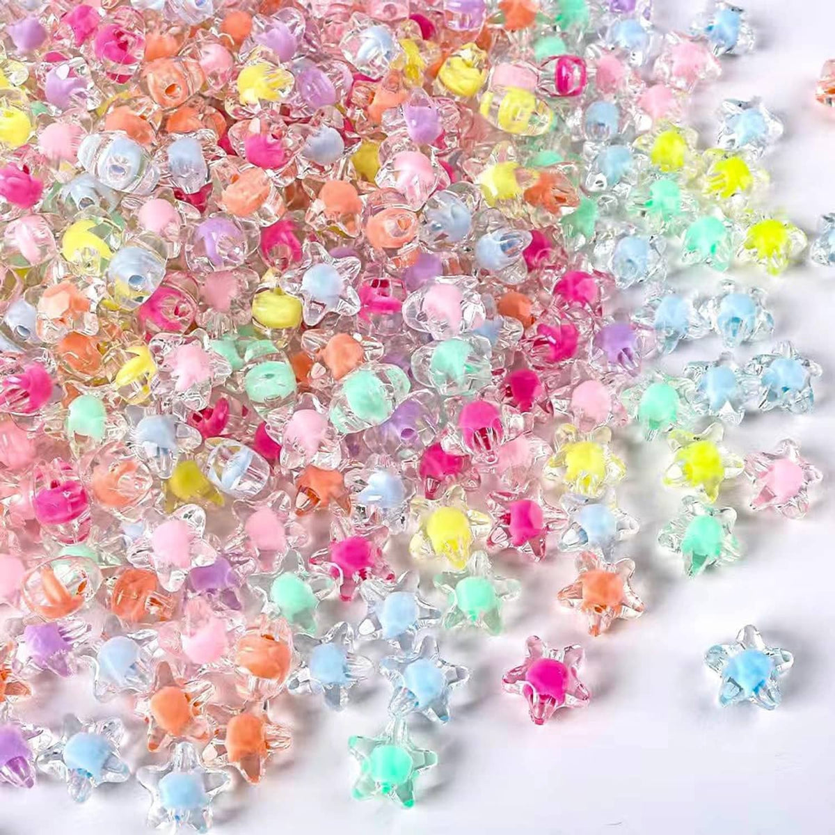 Bulk pile of transparent star beads in mixed colors, clear acrylic for bracelets