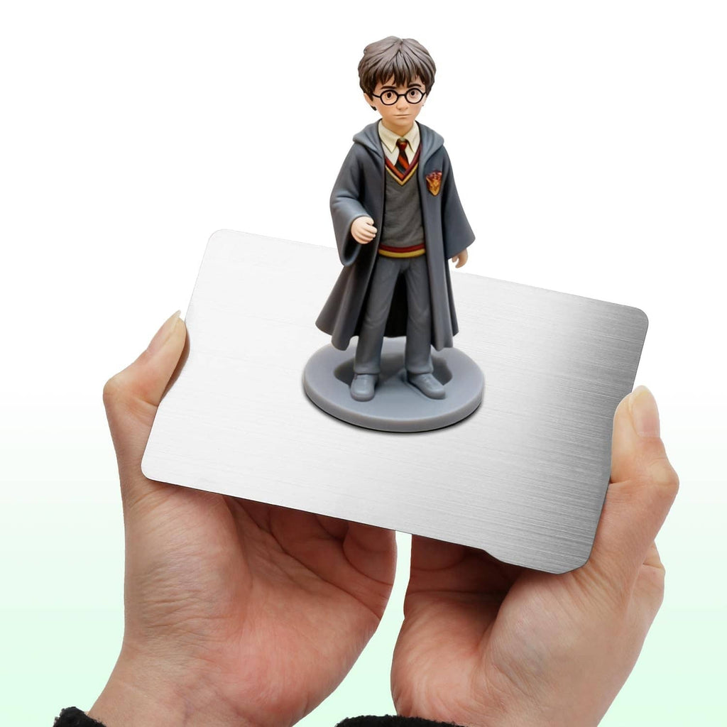 Hands holding a silver flex build plate for resin 3D printing, rounded rectangle shape