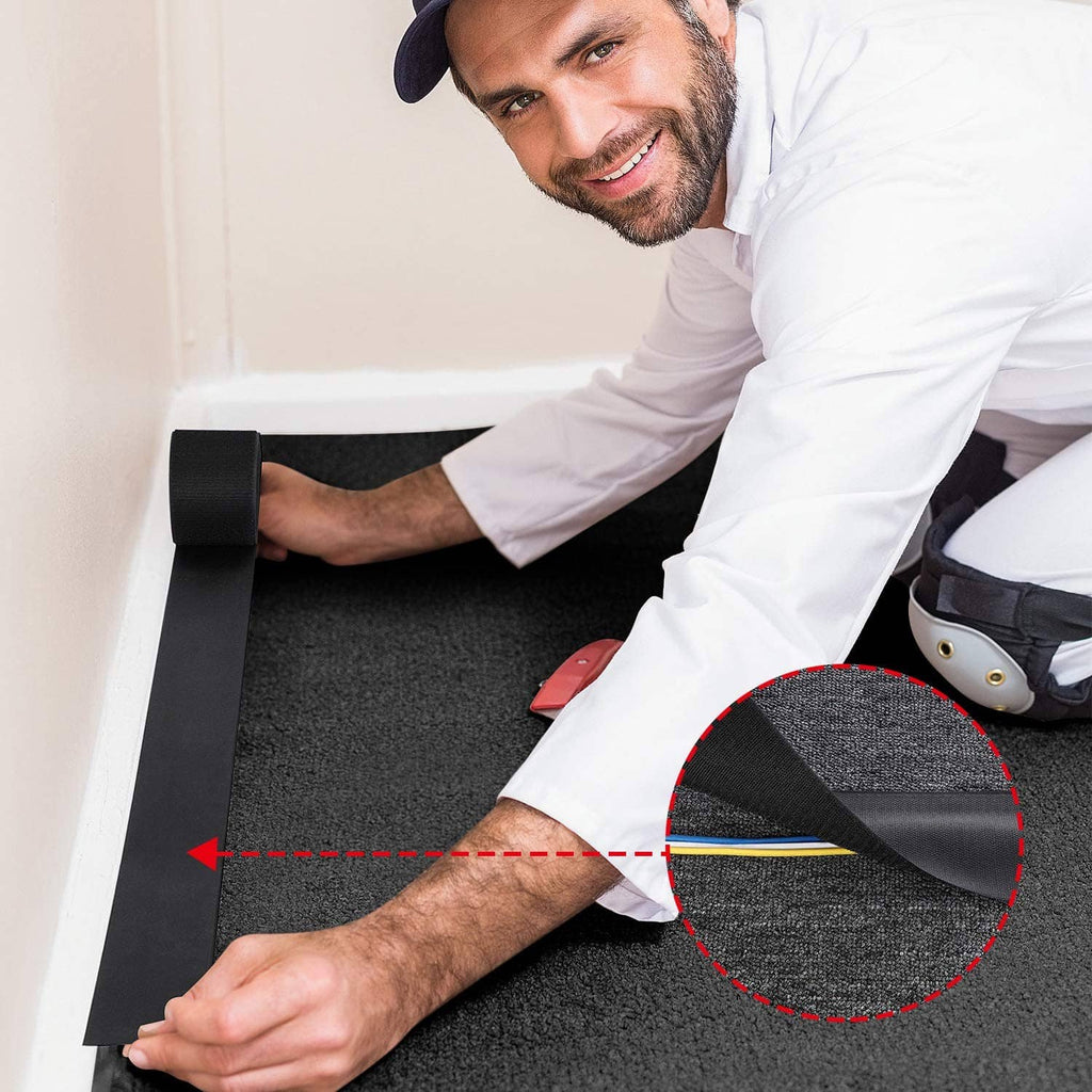 Black cable floor strip installed along carpet edge, highlighted section shows placement