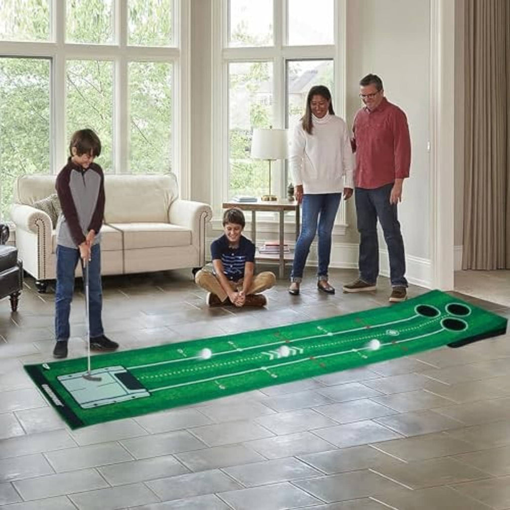 Green floor putting mat with ball tracks and three target holes used indoors