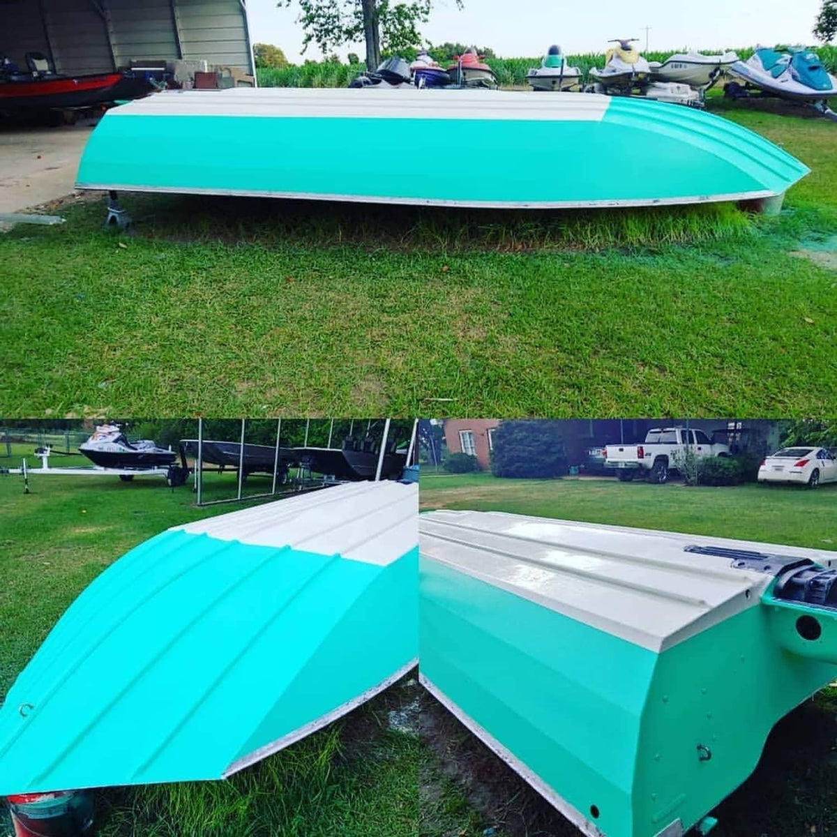 Teal and white boat hull with open bow area, side view