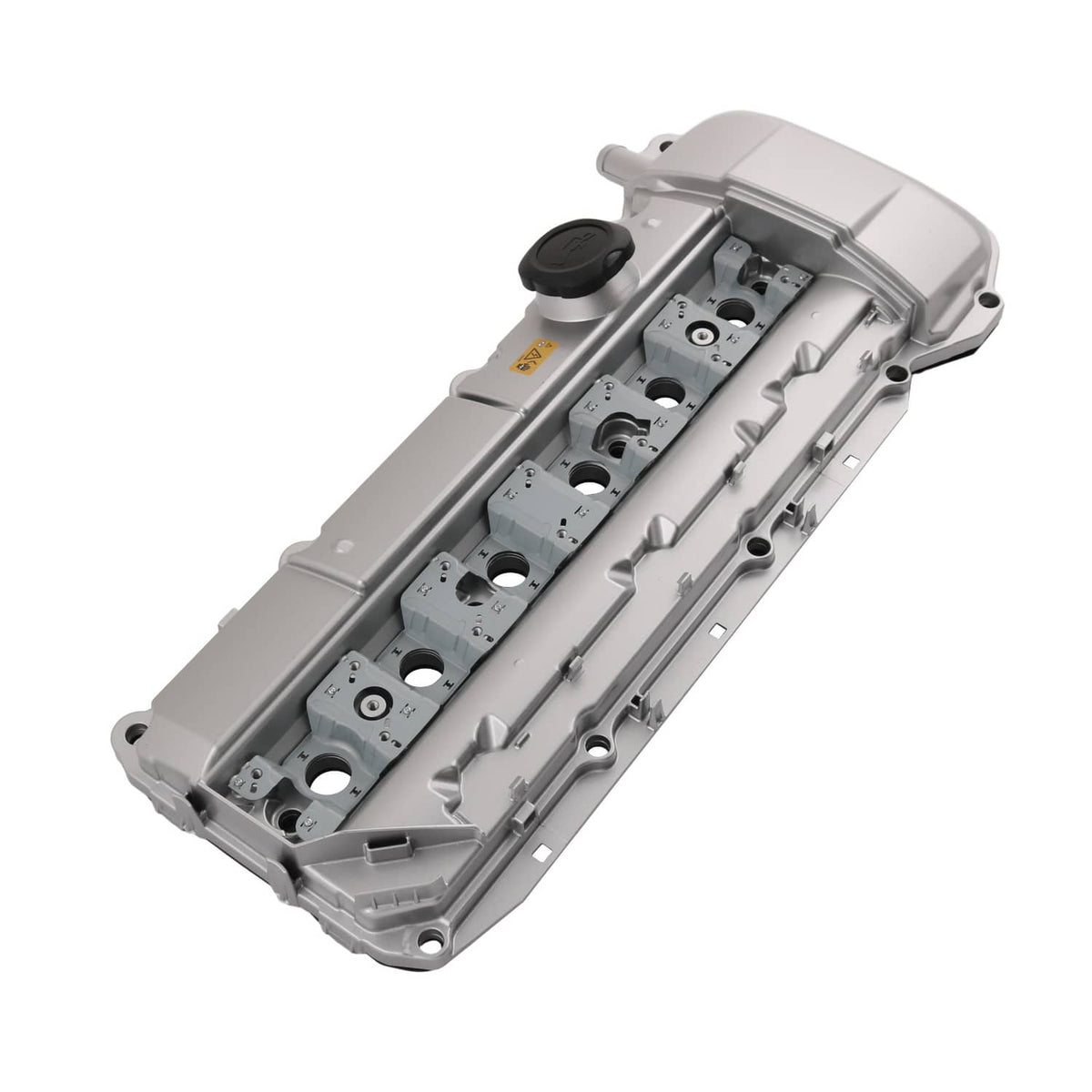 Light gray aluminum valve cover viewed from above, showing bolt holes and oil cap