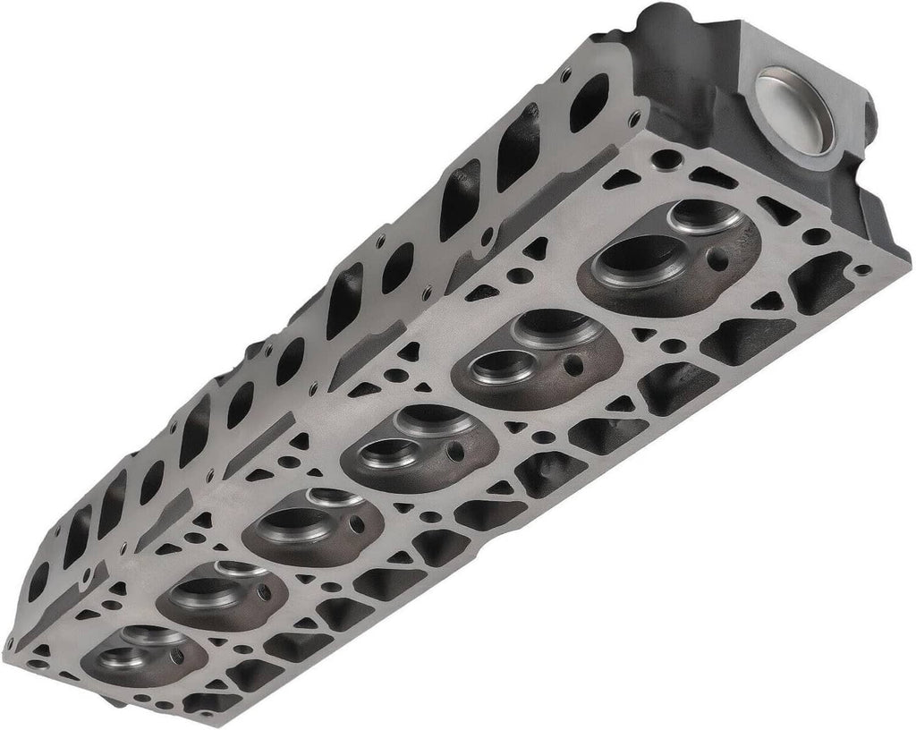Cylinder head with combustion chamber surfaces and round valve seat inserts