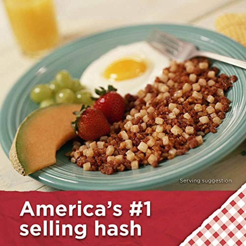 Roast beef hash serving plate with diced potatoes and beef, with fruit garnish