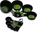 Plastic measuring cup and spoon set featuring black bowls with green measurement numbers