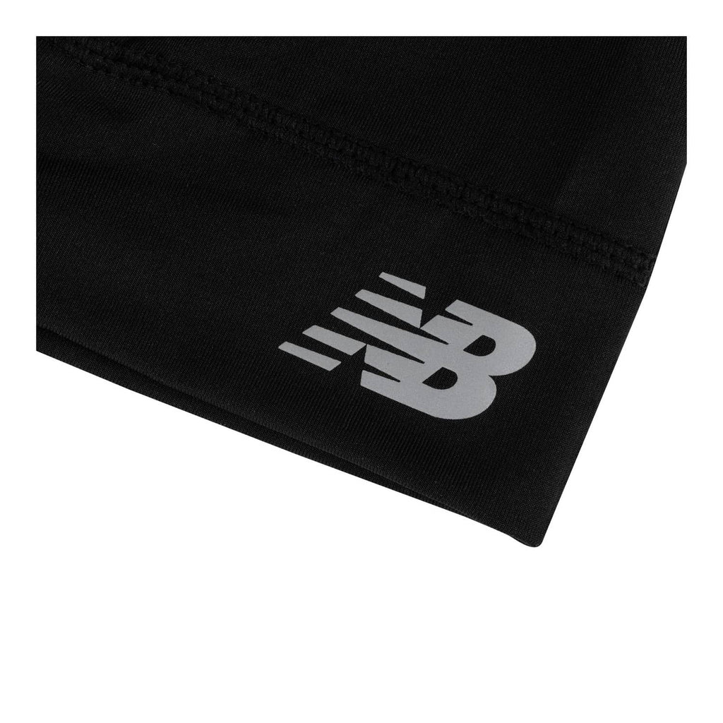 Black skullcap hat with New Balance logo on front band