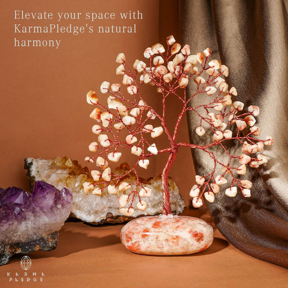 Natural stone tree ornament with red wire branches and orange-pink oval stone base