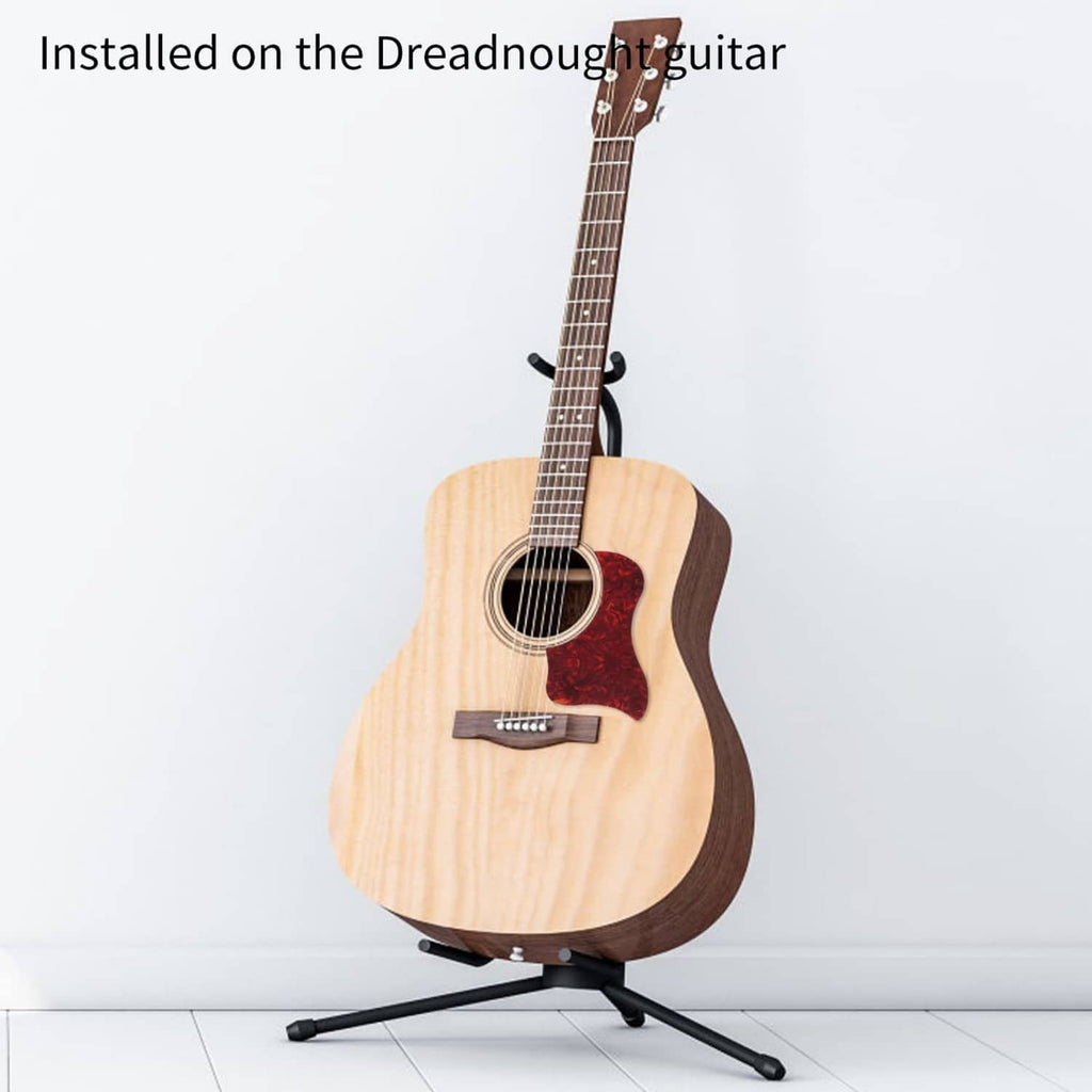 Acoustic guitar with self-adhesive pickguard installed on the soundboard