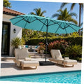 Turquoise patio umbrella with black frame and base, open canopy