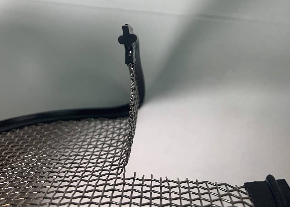 Black gasket with attached metal mesh and clamp fitting for sanitary piping