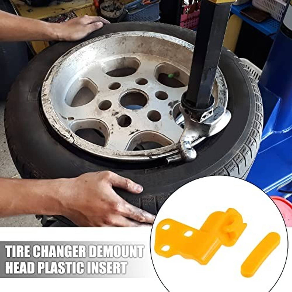 Orange plastic tire changer demount head insert shown in close-up detail