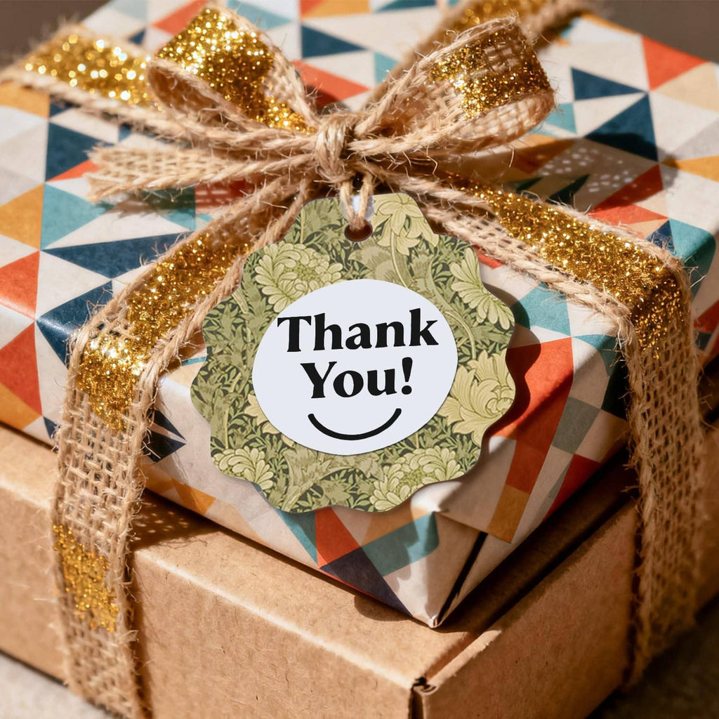 Wrapped gift with classical floral scrapbook paper, green botanical label reading "Thank You!".