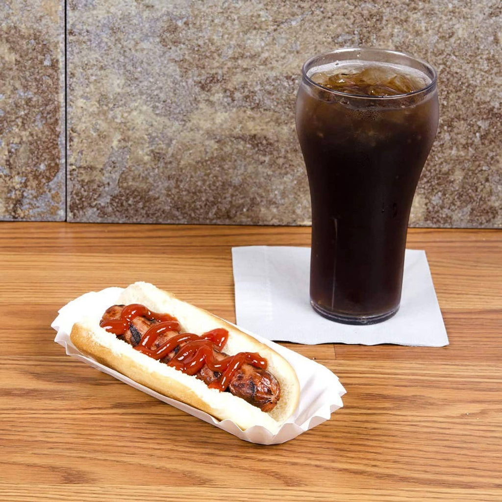 White paper hot dog tray with hot dog and condiments