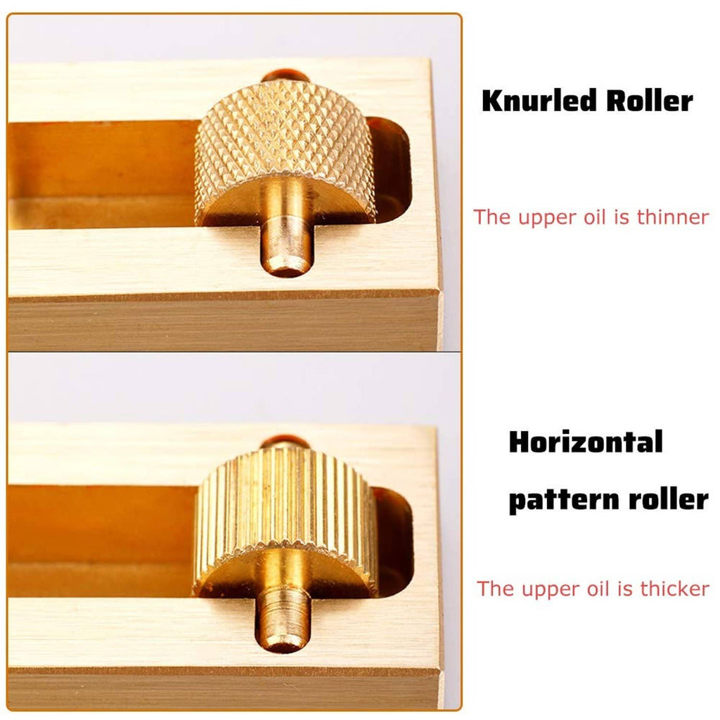Leather edge paint tool with knurled and lined pattern brass rollers, close-up