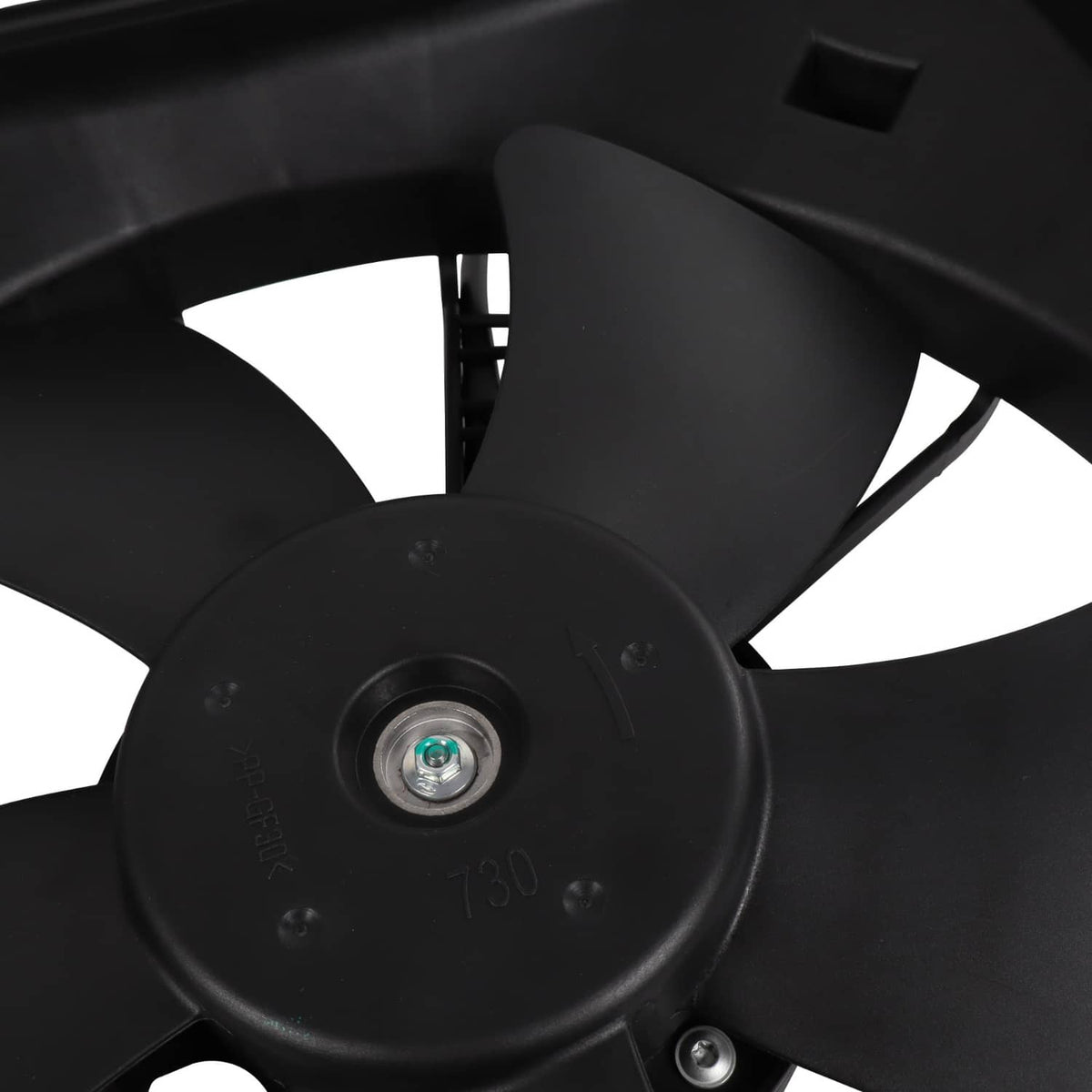 Close-up of radiator fan motor hub with center bolt and black blade mounting