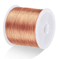 Rose gold 26-gauge jewelry wire spool on white plastic reel