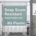 Clear plastic shower curtain liner hanging over bathtub, smooth and transparent