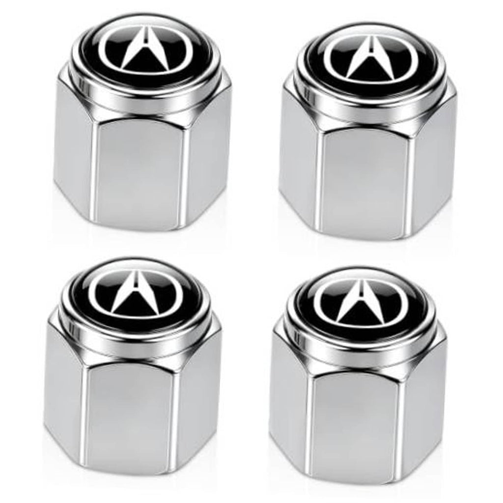 Silver metal tire valve stem caps with black tops and white emblem, four-pack view