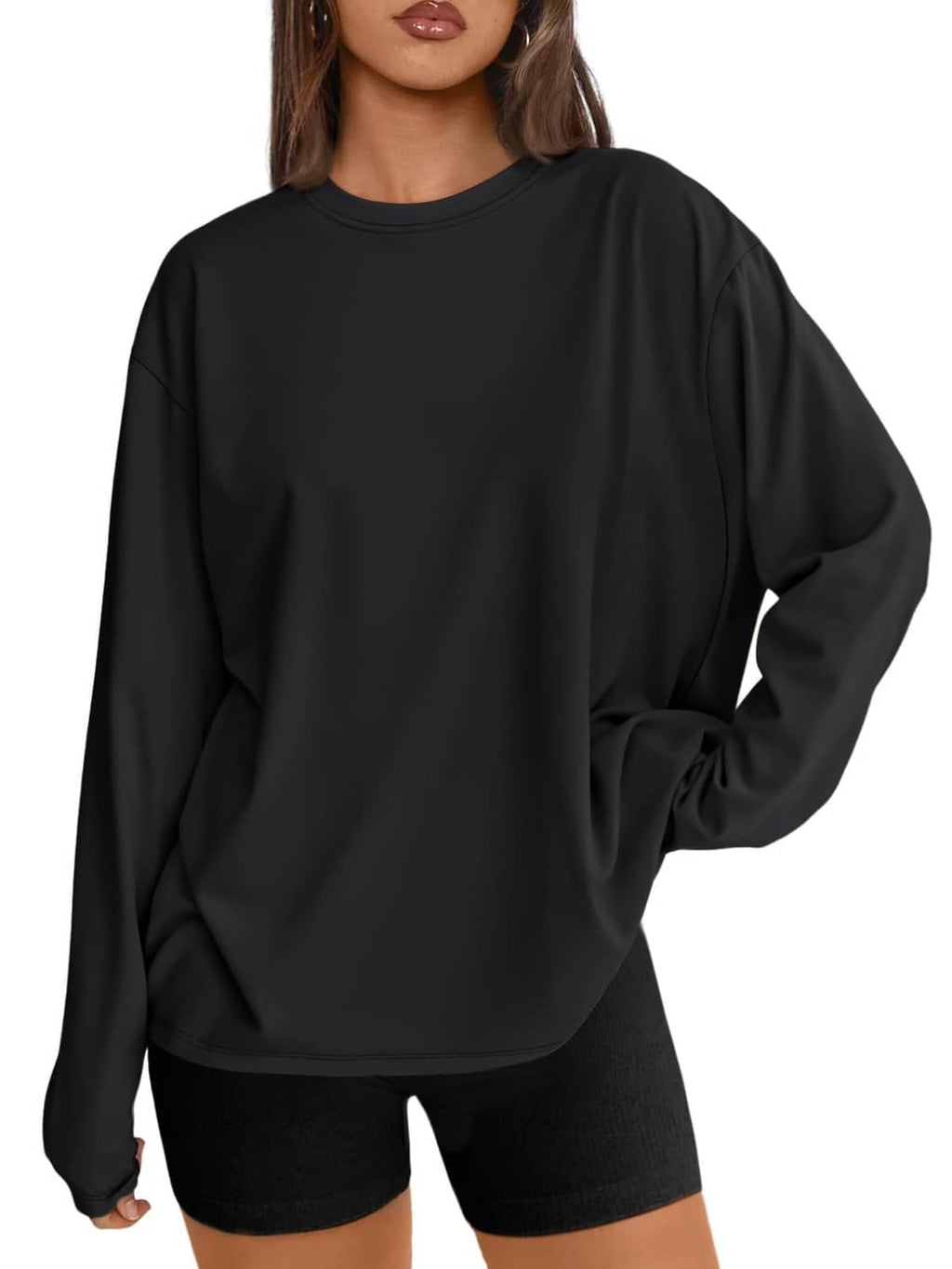 Women’s oversized long sleeve T-shirt in black, relaxed fit hem over shorts