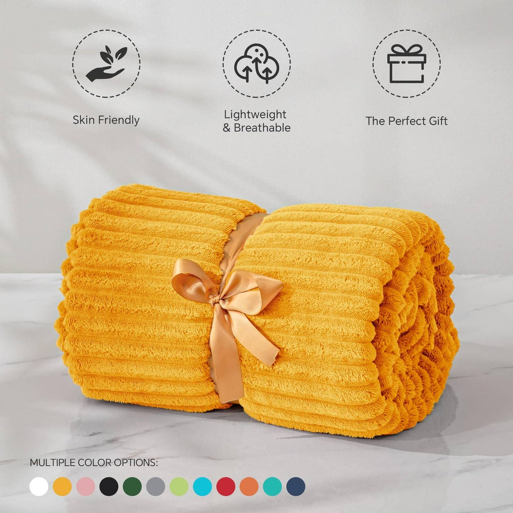 Folded yellow 3D ribbed jacquard fleece blanket with ribbon bow