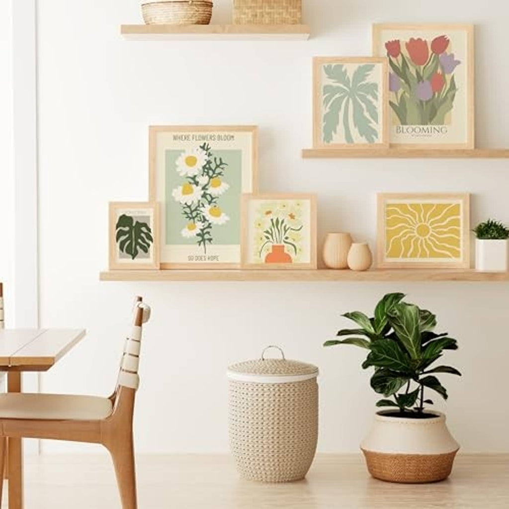 Set of natural solid wood picture frames with clear plexiglass displaying artwork