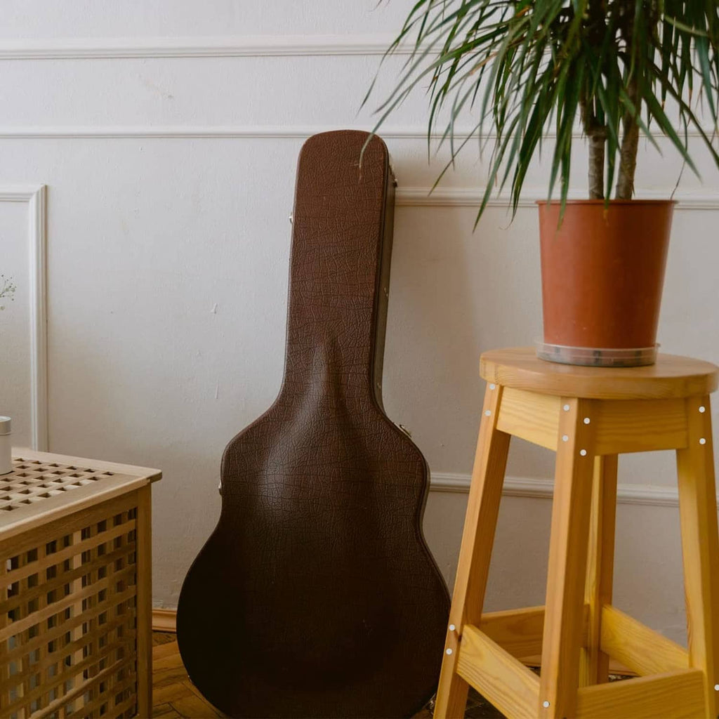 White plastic plugs on wooden stool legs and base edges beside decor