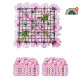 Artificial pink flower wall panel with green mesh grid and layered 3D petals
