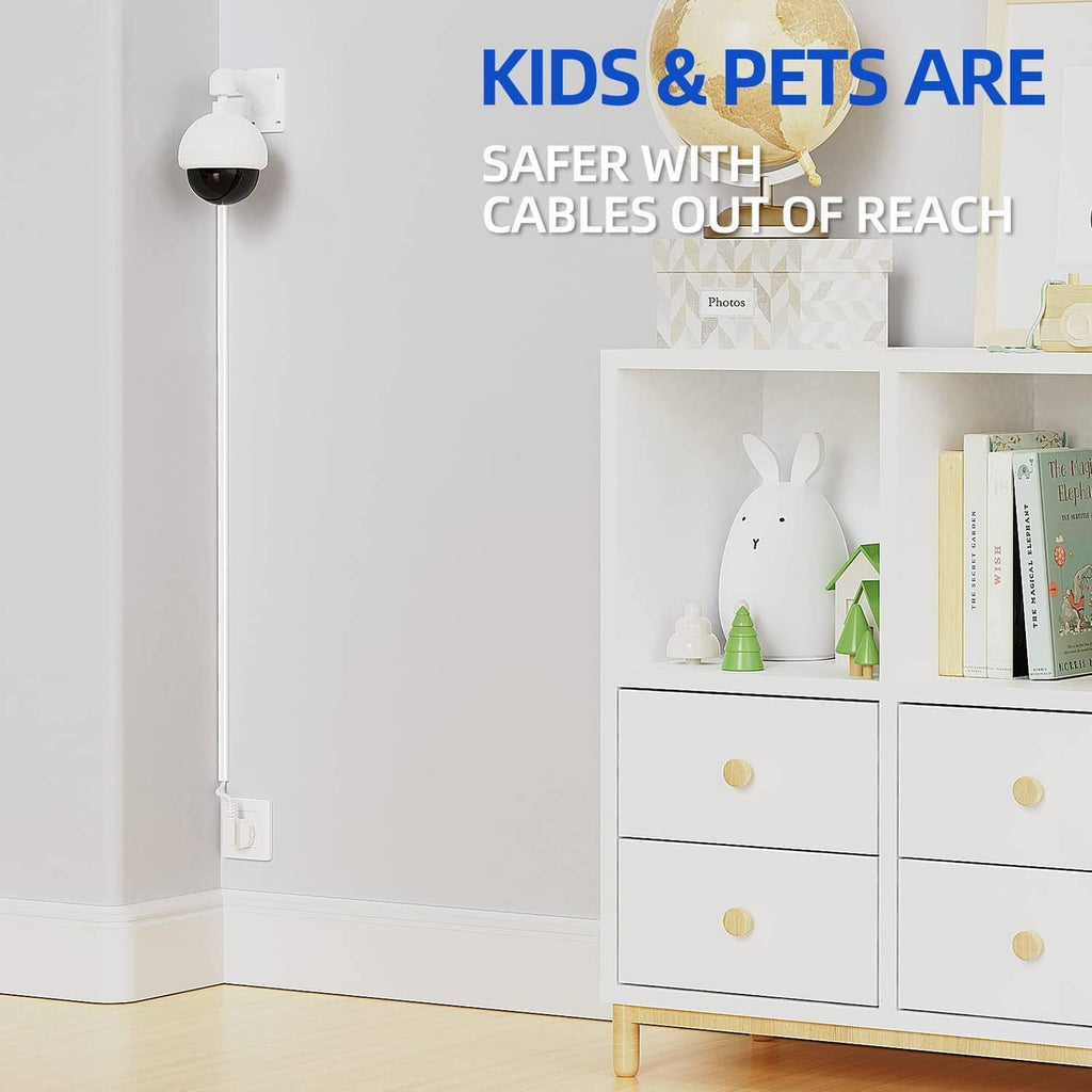 White cord hider raceway running from outlet along the wall, cords kept out of reach