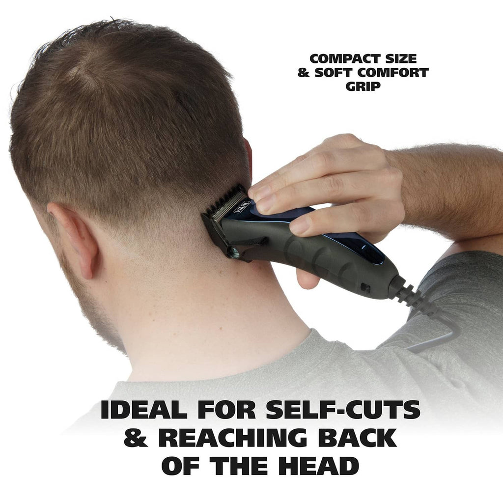 Grey and blue corded personal hair clipper being used on the back of a head